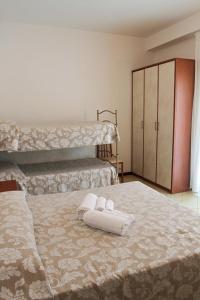Postel nebo postele na pokoji v ubytování Hotel Ariston + 24 fotografií