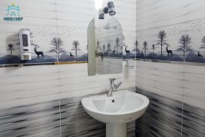 a bathroom with a sink and a mirror at Habib Camp in Abu Simbel