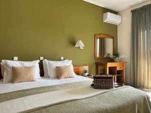 Posteľ alebo postele v izbe v ubytovaní Hotel Cariatis