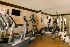 a gym with a bunch of exercise equipment in a room at Sonder at The Point in Orlando