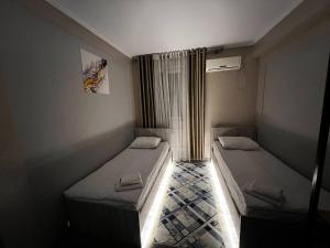 Postel nebo postele na pokoji v ubytování Ave hotel