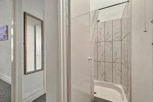 a bathroom with a shower with a glass door at Finest Retreats - Atherfield Apartments No 5 - Sea Views in Paignton