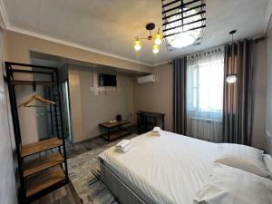 Postel nebo postele na pokoji v ubytování Ave hotel