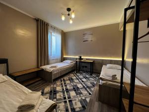 Postel nebo postele na pokoji v ubytování Ave hotel