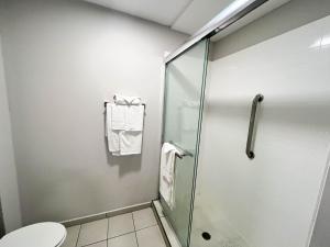 a shower stall in a bathroom with a toilet at Motel 6 Williamstown, NJ Black Horse Pike in Williamstown