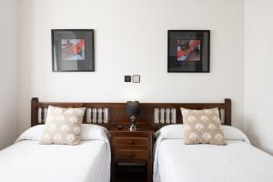 A bed or beds in a room at Posada La Olma