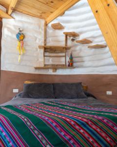 a bedroom in a tree house with a bed at DOMOS PUJLLAI San Pedro de Atacama in San Pedro de Atacama
