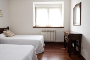 A bed or beds in a room at Posada La Olma