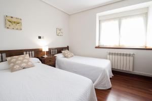 A bed or beds in a room at Posada La Olma