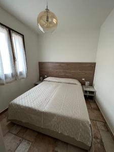 A bed or beds in a room at HomeStyle Agorà