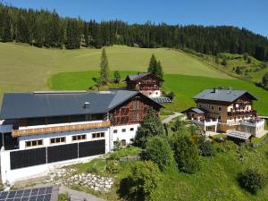 an aerial view of a house on a hill at Bio Alpenhof Rostatt in Bischofshofen