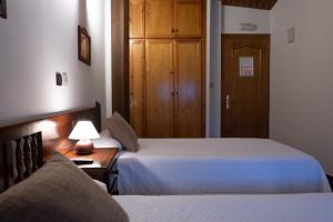 A bed or beds in a room at Posada La Olma