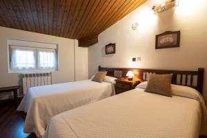 A bed or beds in a room at Posada La Olma