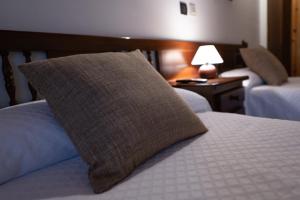 A bed or beds in a room at Posada La Olma