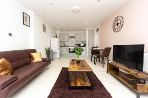 a living room with a couch and a coffee table at Modern One Bed Flat Lowestoft in Lowestoft