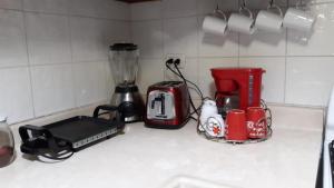 a kitchen counter with a blender and a coffee maker at Adorable Santo Domingo in Santo Domingo