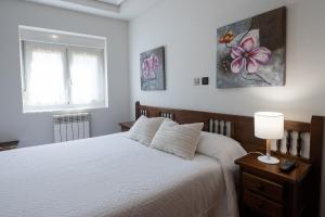 A bed or beds in a room at Posada La Olma