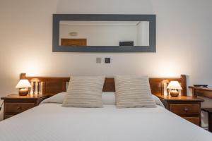 A bed or beds in a room at Posada La Olma