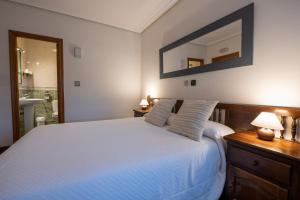A bed or beds in a room at Posada La Olma