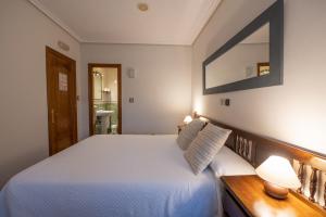 A bed or beds in a room at Posada La Olma