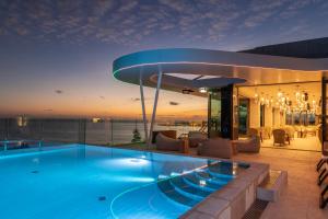 a swimming pool on the roof of a house at EVOLUTION Cascais-Estoril Hotel in Estoril