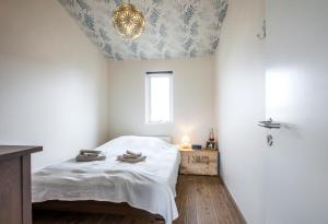 Postel nebo postele na pokoji v ubytování Blue House B&B