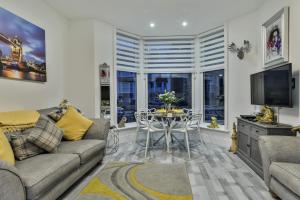 a living room with a couch and a table at Tudor House Holidays - The Apartment for 2 people in Scarborough