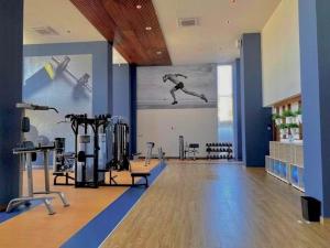a gym with a picture of a man on the wall at Apartment In Camino Al Mar with Amazing View of the Ocean, Beach and Swimming Pool, 2 Rooms in Mazatlán