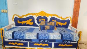 Un pat sau paturi într-o cameră la L'Oasis à Tozeur
