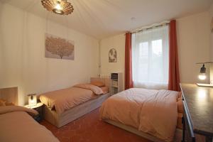 Postel nebo postele na pokoji v ubytování La Petite Folie