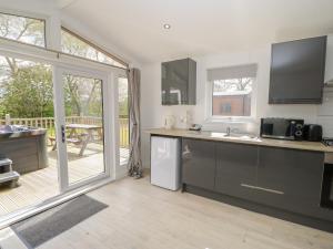 a kitchen with a sink and a counter top at Roseberry Pod in Yarm