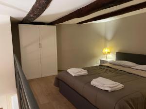 מיטה או מיטות בחדר ב-Suite Della Porta