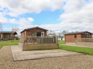 a home with a deck and a house at Roseberry Pod in Yarm