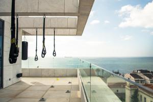 a view of the ocean from the balcony of a building at EVOLUTION Cascais-Estoril Hotel in Estoril