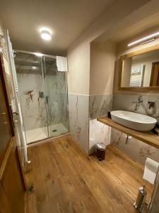 a bathroom with a tub and a sink and a shower at signoria flat 5* centro storico in Florence