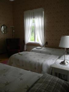 Postel nebo postele na pokoji v ubytování B&B Savikon Kartano