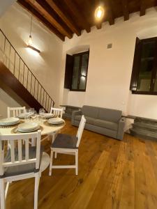 a living room with a table and a couch at signoria flat 5* centro storico in Florence