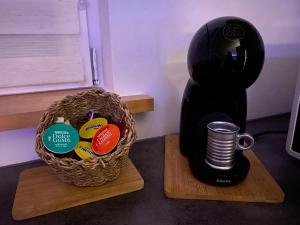 a black gorilla sitting next to a basket with a cup at Dm cocooning in Richemont