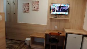 A television and/or entertainment centre at HARTMANN PANZIÓ