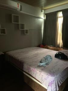 Tempat tidur dalam kamar di Casas de praia Cassino 1 (ampla) e 2 (Single)