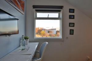 TV a/nebo společenská místnost v ubytování Blue House B&B