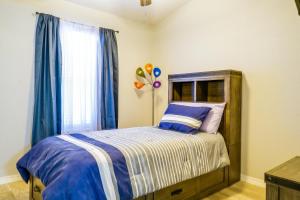 a bedroom with a bed and a window with balloons at Pet-Friendly El Paso Retreat 20 Mi to Downtown! in El Paso