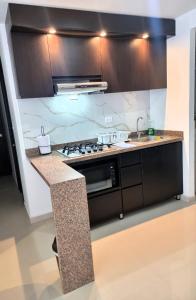 Fotografija u galeriji objekta HERMOSO APARTAMENTO DE LUJO CON PISCINA PARQUEADERO Y VIGILANCIA PRIVADA SILVER PARK u gradu Kukuta