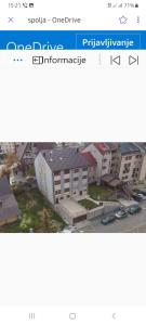 a page of a website with a picture of a building at Apartments Gorska in Kolašin