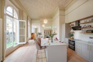 a kitchen with a counter and a large window at The Sovereign Suite - 2 Bedroom Apartment in Central Bristol by Mint Stays in Bristol