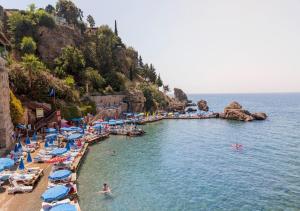 a group of people in the water at a beach at Sera Homes Kaleici Oldtown in Antalya