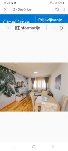 a website of a living room with a dining room at Apartments Gorska in Kolašin