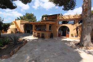 a house with a porch and a patio at Finca Can Toni in Sant Jordi