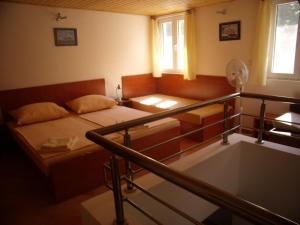Postel nebo postele na pokoji v ubytování Apartments Sunce