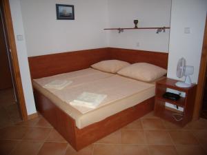 Postel nebo postele na pokoji v ubytování Apartments Sunce